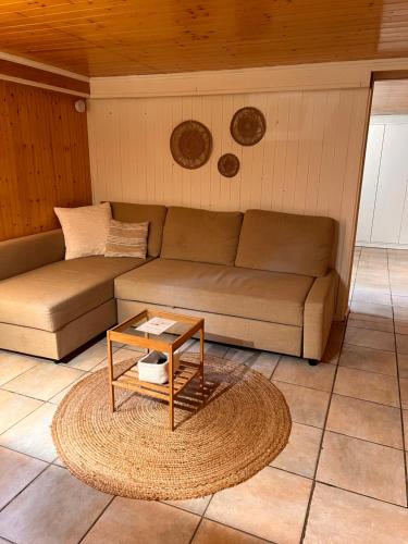 a living room with a couch and a table at Roche for Toit in Rochefort