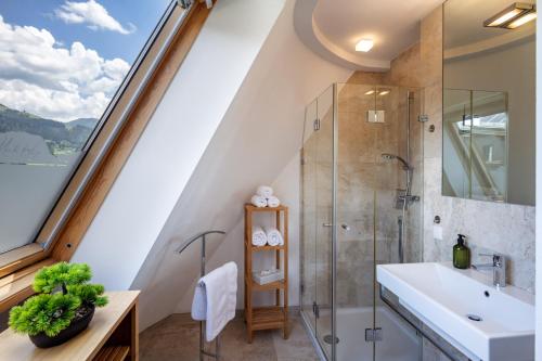 a bathroom with a sink and a shower at Martinshof in Sankt Johann in Tirol