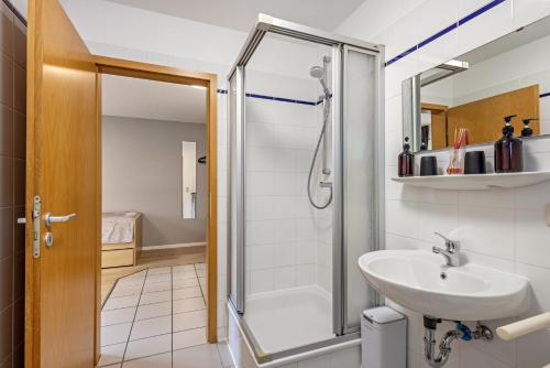 a bathroom with a shower and a sink at Apartments Lübeck in Lübeck