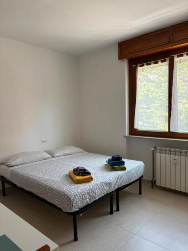 a bedroom with a bed with two towels on it at RESIDENCE Erminia in Novara