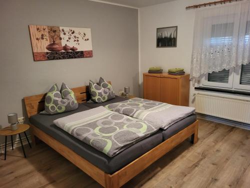 a bedroom with a bed and a window at Ferienwohnung in Hameln am Wald in Hameln