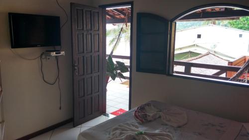 Televisyen dan/atau pusat hiburan di Pousada Mar de Araçatiba