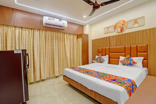 a bedroom with a large bed in a room at FabHotel Royal Atlantis Studio Apartments in Chennai