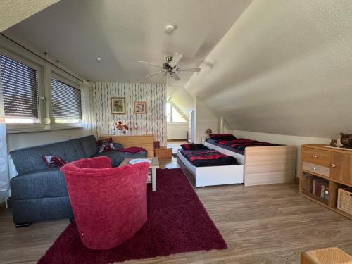 a living room with a couch and a bed at Haus Reinsdorf in Blankenburg