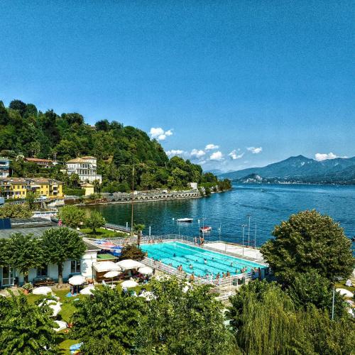a large swimming pool in the middle of a lake at Residenza Ticino in Intra