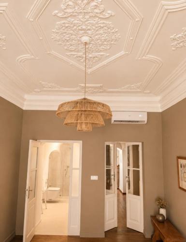a ceiling with a chandelier in a room at CASA d’OLIVENÇA in Elvas