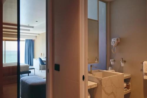 a bathroom with a sink and a mirror at Albergo Da Carmine in Castellabate