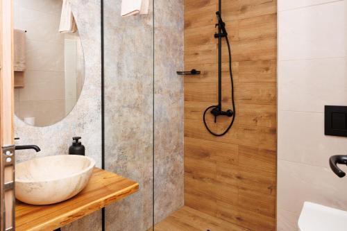 a bathroom with a sink and a shower at Limani Vasiliko in Tsarevo