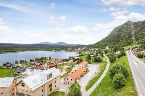 an aerial view of a small town next to a lake at Olen Village - Funäsdalen in Funäsdalen