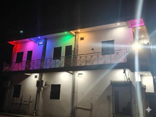 a building with colorful lights on it at night at Hotel ram priya in Chhatarpur
