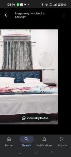 a picture of a bed in a room at Hotel ram priya in Chhatarpur
