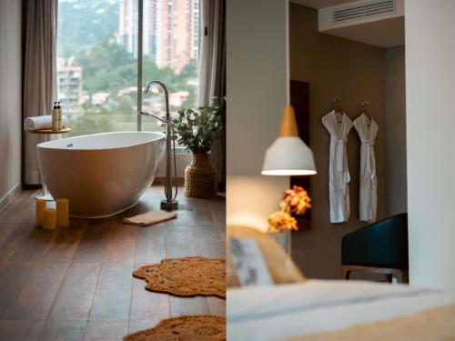 a bathroom with a bath tub and a bedroom at Novotel Medellin El Tesoro in Medellín