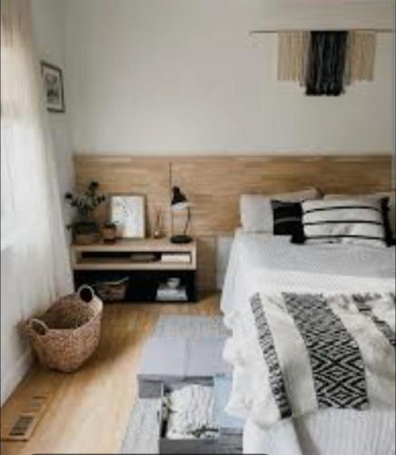 a bedroom with a bed and a table in it at 4cs apartment in Bayanan