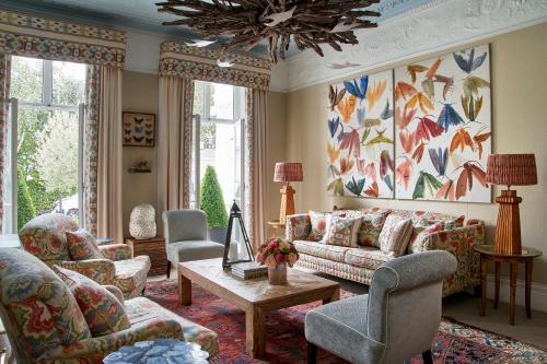 a living room with a couch and chairs and a table at Number Sixteen, Firmdale Hotels in London