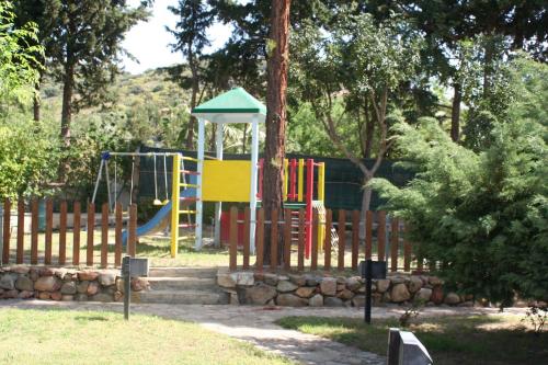 a playground in a park with a play structure at Verdemare Sardegna Uno in Villasimius