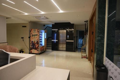 an empty room with a lobby with a vending machine at Galaxy Air Suites in Bangalore