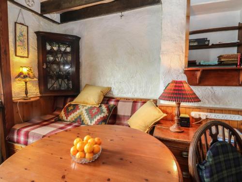 a living room with a table and a couch at 4 Whiterow in Appin