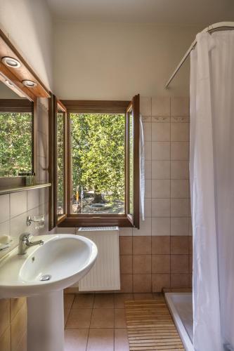 a bathroom with a sink and a shower at KissosInn in Kissos