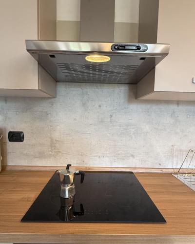 a kitchen with a coffee pot on a kitchen rug at Il Ranch in Baveno
