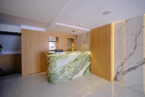 a room with a marble wall with a counter at The Rizon Hotel in Antalya