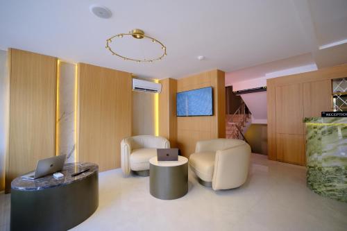 a room with two chairs and a table with a laptop at The Rizon Hotel in Antalya