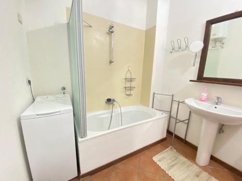 a bathroom with a tub and a sink at GMD Sweet Home in Policoro