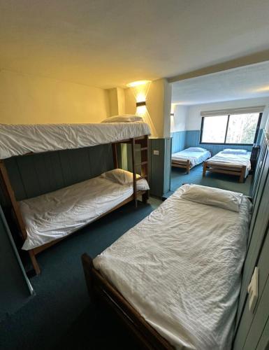 a room with two bunk beds and a window at Mon Refuge 123 in Bcharré