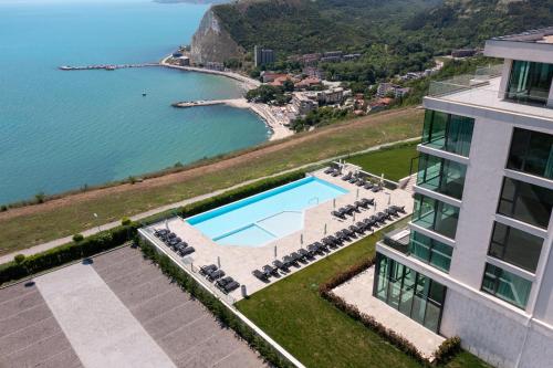 an aerial view of a building with a swimming pool at Calithea Residence in Kavarna