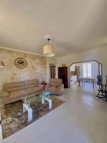 a living room with a couch and a table at La Lidia in Sassari