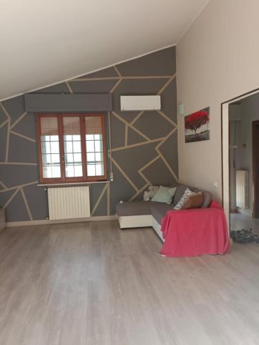 a living room with a couch and a wall at La Rondine Atessa in Atessa