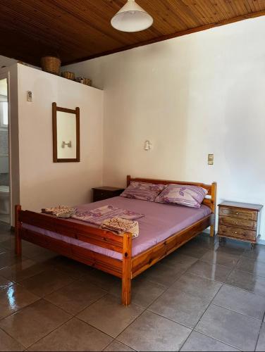 a bedroom with a bed in a room at LYGIROS ANASTASIOS in Tarti