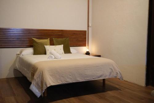 a bedroom with a large bed with a lamp on it at Loft Pedreña Studio in Pedreña
