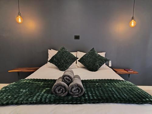 a bed with towels on top of it at Unit 9 Dinas Accommodation Oranjemund in Oranjemund