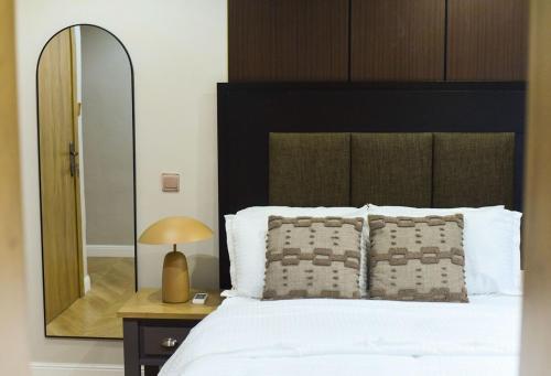 a bedroom with a large bed with a mirror at One Bedroom, Double bed and one sofa bed in Iseri
