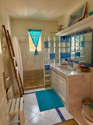 a bathroom with a sink and a shower at Villa des Delices in Grimaud