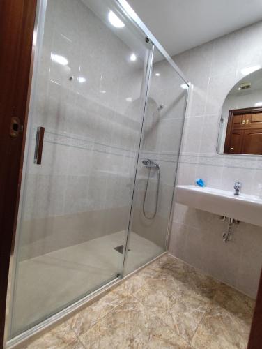 a bathroom with a shower and a sink at Hotel Restaurante Campomar in Cartagena