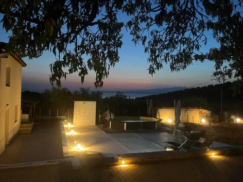 a view of a skate park at night with lights at Olive Hill Guest House in Limenas