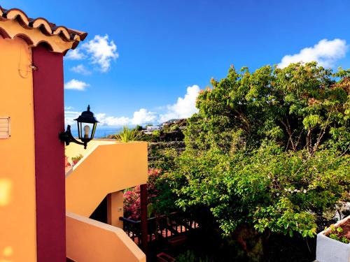 a view of a house with a street light and trees at Los Nacientes: Marcos in Los Sauces