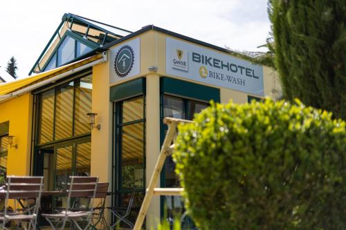 a building with a sign on the side of it at Bike- und Ferienhotel Freiburg in Freiburg im Breisgau