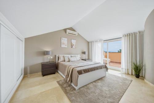 Spacious Penthouse in Elviria with 4 Pools and Large Terrace