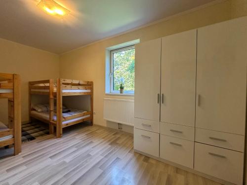 a bedroom with two bunk beds and a window at Copa in Zeltweg