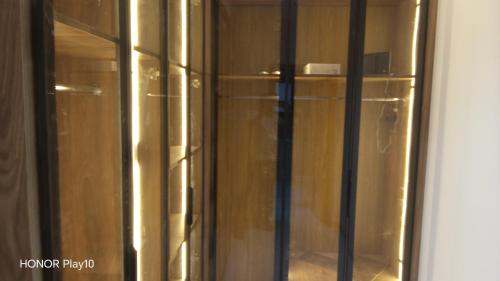 a glass door of a cabinet in a room at Elin house in Hammamet