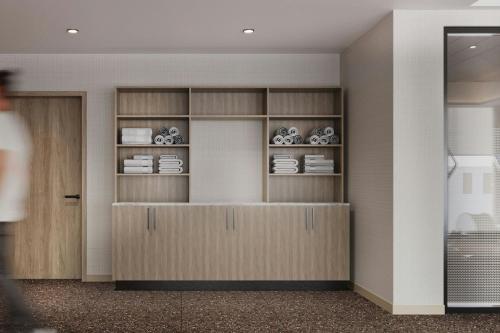 a room with shelves with dishes on them at AC Hotel by Marriott Denver RiNo in Denver