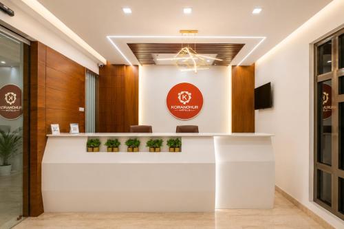 a lobby of a hospital with a reception counter at K Grandeur Hotels- South Railway Station in Cochin