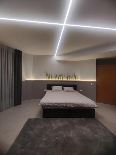 a bedroom with a bed in a room at Апартамент Skyline in Yambol