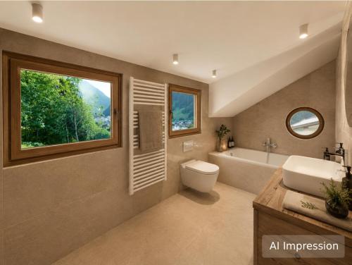 a bathroom with a sink and a toilet and a tub at Haus Lina in See