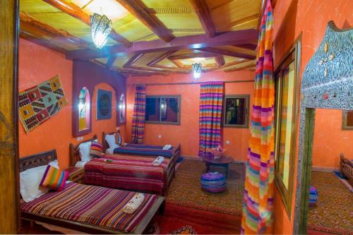 a bedroom with two beds in a room at Kasbah Imlil in Imlil