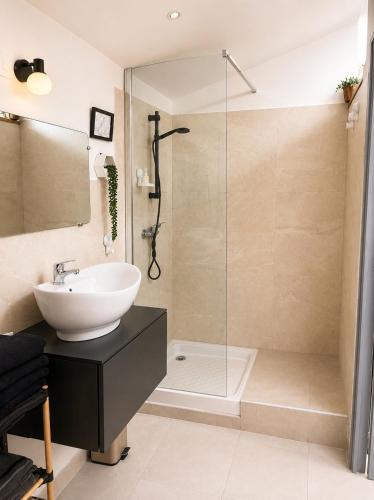 a bathroom with a sink and a shower at L'oléastre en Luberon 2 in Grambois