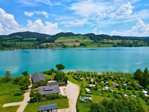 an aerial view of a camping area next to a lake at Cubes am Irrsee - SELF CHECK-IN in Sommerholz