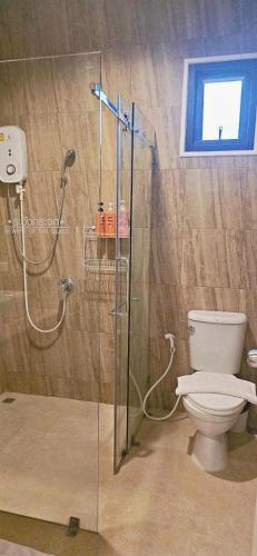 a bathroom with a shower and a toilet at 90 9 Pool Villa Chiang Mai in Ban Pa Ngae